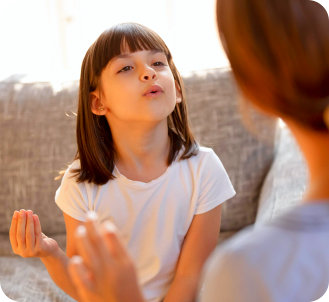 a female kid blowing