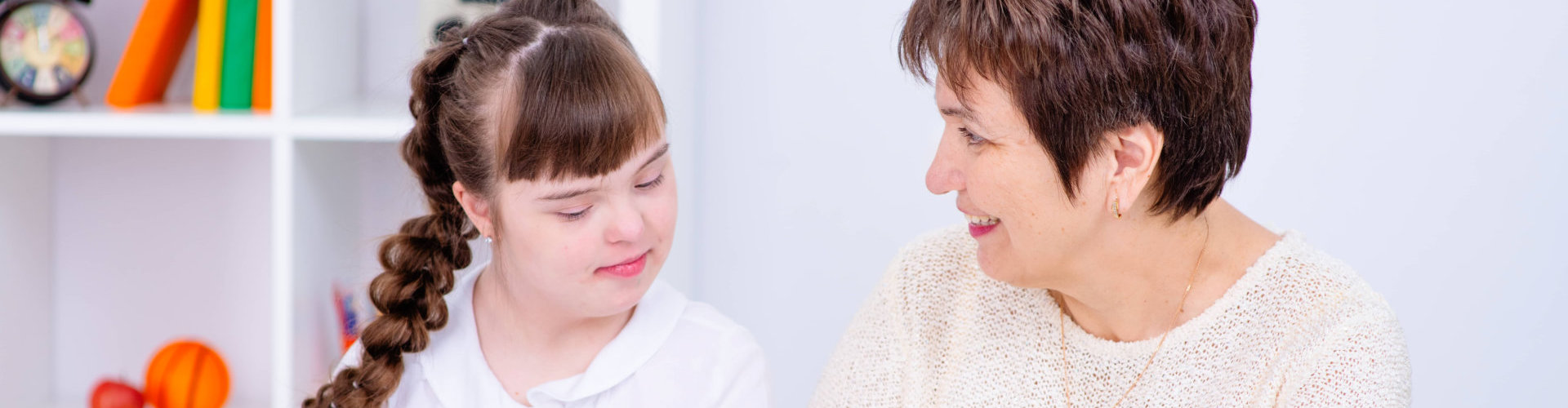 image of a female kid with an adult woman smiling